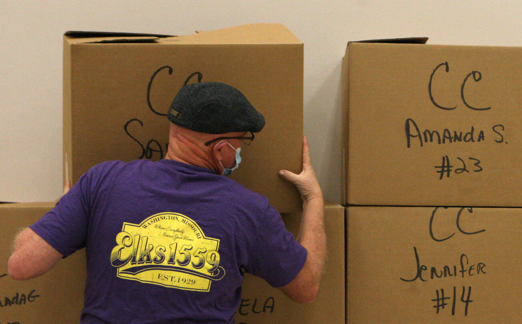 Mike McCartney stacks boxes